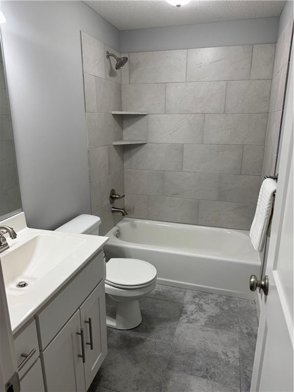 full bath with a textured ceiling, toilet, shower / bath combination, and vanity