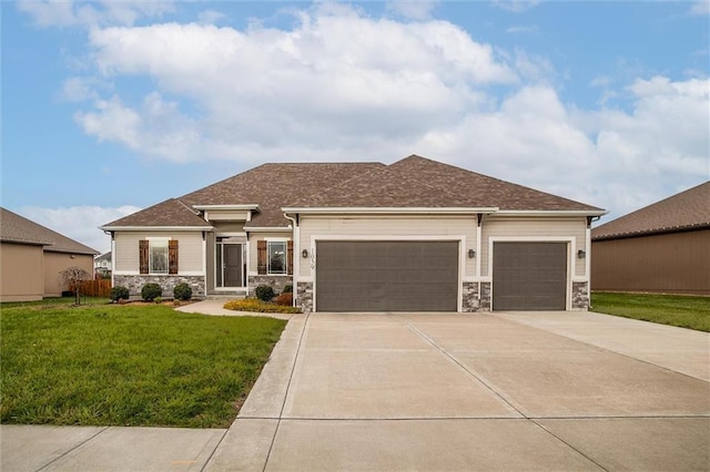 view of front of property featuring a shingled roof, concrete driveway, a front yard, stone siding, and an attached garage