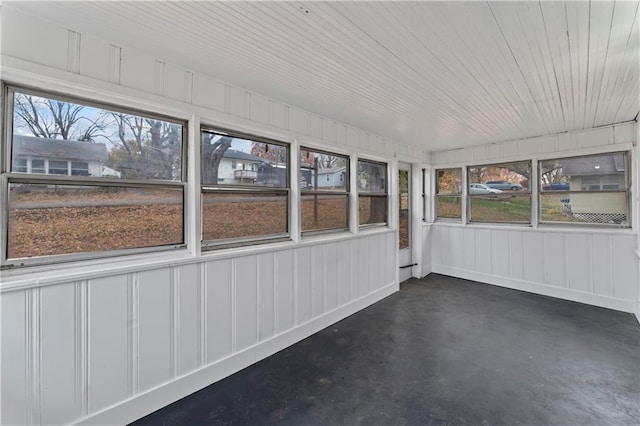 unfurnished sunroom with a wealth of natural light