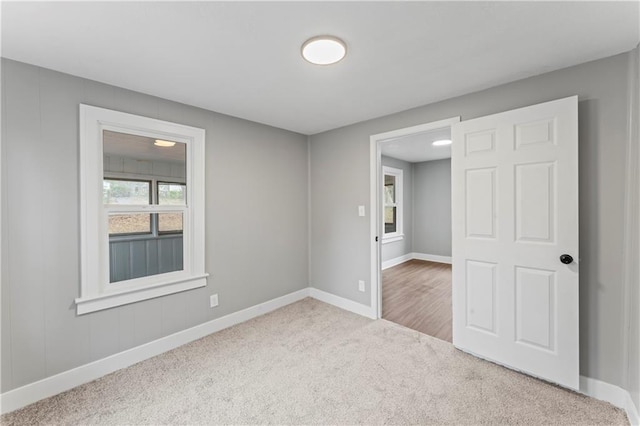 empty room with carpet flooring