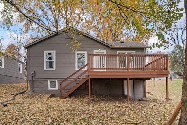 back of property featuring a wooden deck