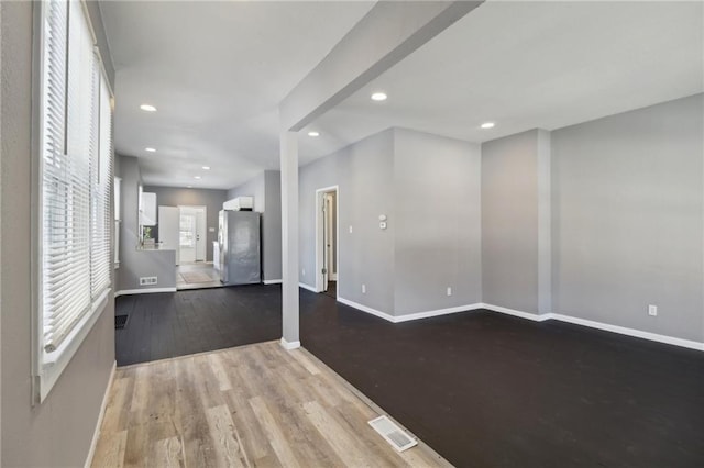 unfurnished living room featuring light hardwood / wood-style flooring