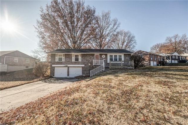 view of front of house with a garage and a front lawn