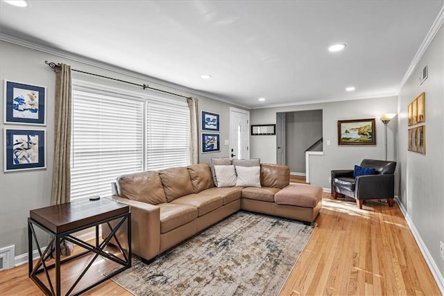 living room with crown molding and wood-type flooring