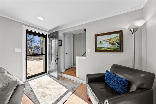 interior space with light hardwood / wood-style floors and crown molding