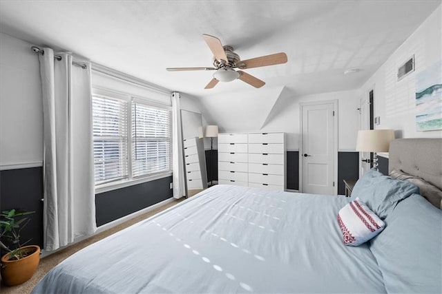 bedroom with carpet, ceiling fan, and lofted ceiling