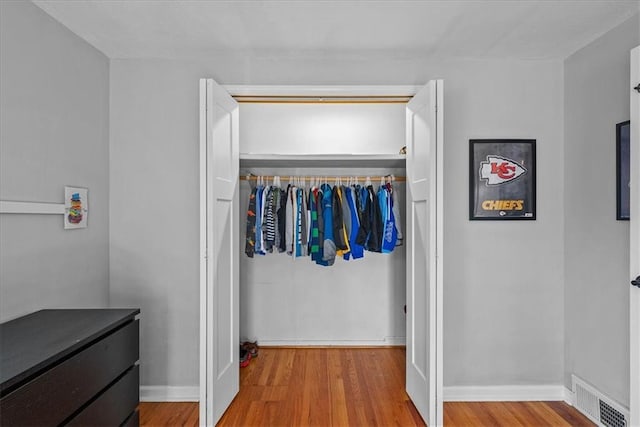 interior space with hardwood / wood-style flooring and a closet