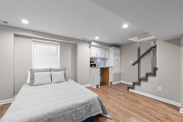 bedroom with light hardwood / wood-style floors