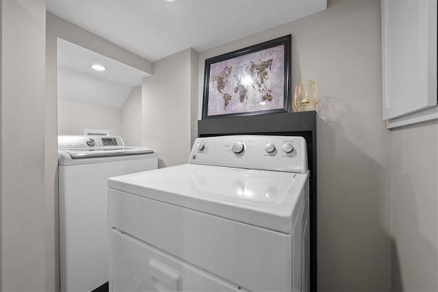 clothes washing area featuring washer and dryer