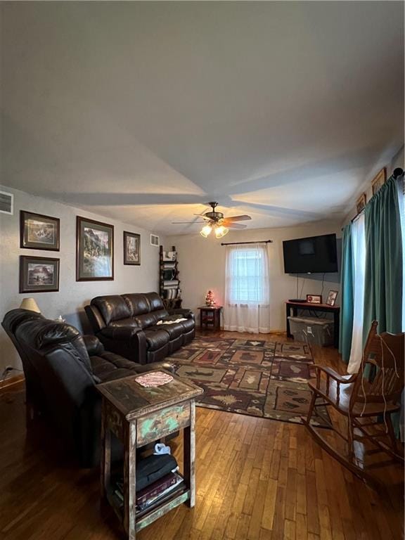 living room with ceiling fan and hardwood / wood-style floors