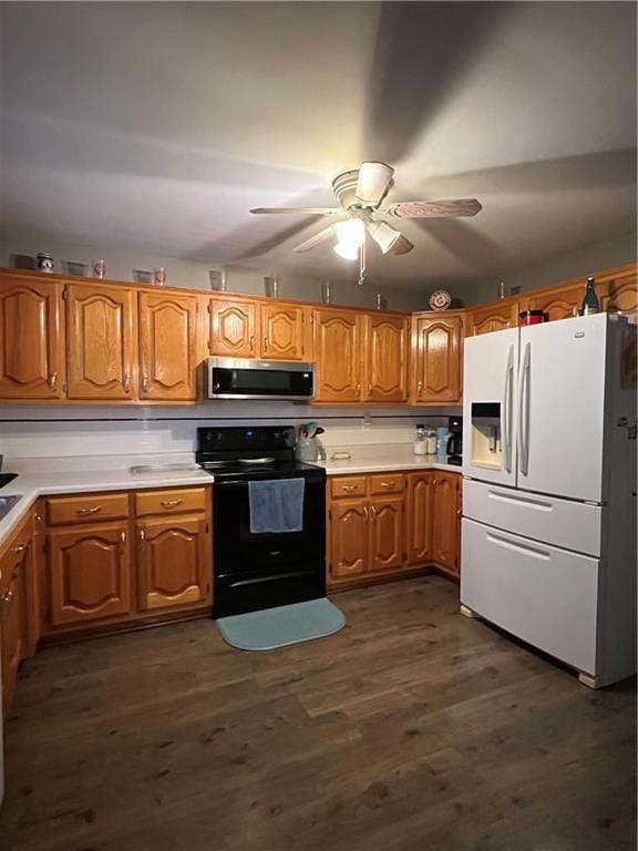 kitchen with dark hardwood / wood-style flooring, ceiling fan, black stove, and white fridge with ice dispenser