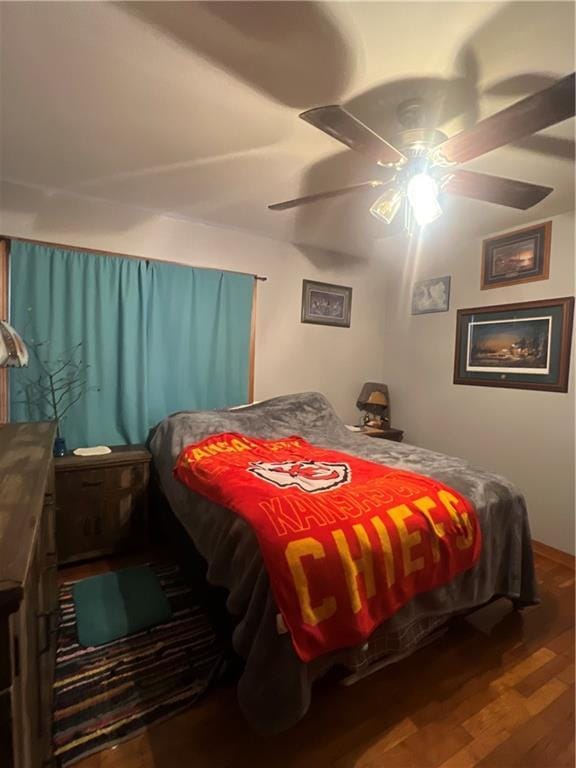 bedroom with ceiling fan and hardwood / wood-style flooring