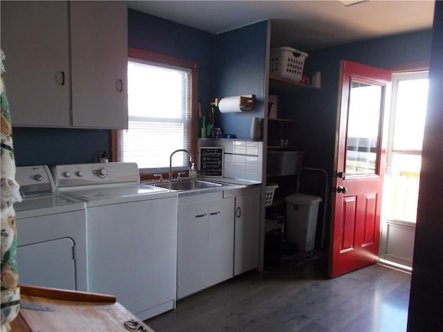 washroom featuring cabinets, independent washer and dryer, sink, and hardwood / wood-style floors