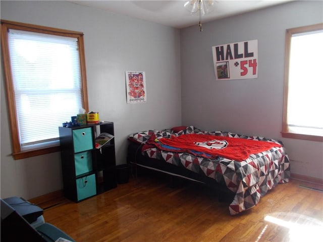 bedroom featuring ceiling fan and hardwood / wood-style floors