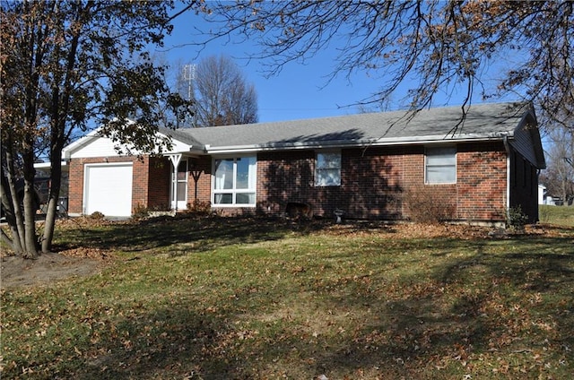 ranch-style house with a garage and a front yard