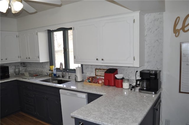 kitchen with decorative backsplash, ceiling fan, sink, dishwasher, and white cabinetry