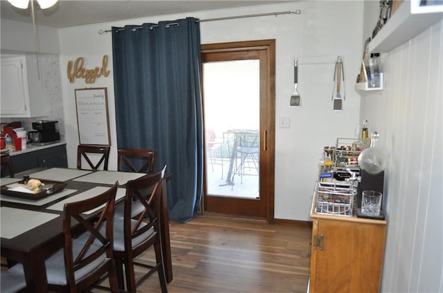 dining room featuring dark hardwood / wood-style flooring