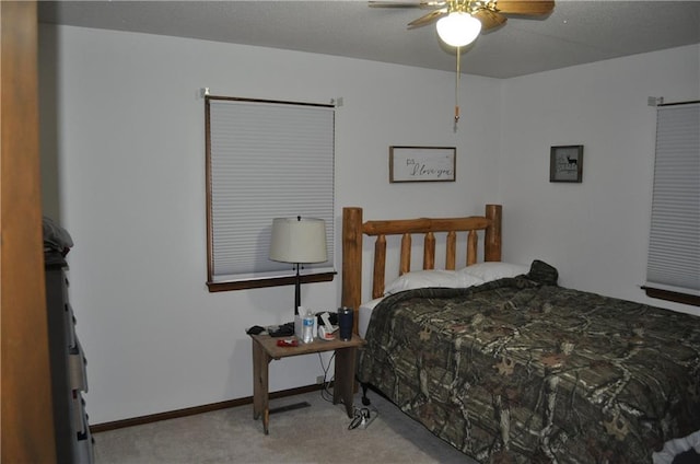 bedroom with light colored carpet and ceiling fan