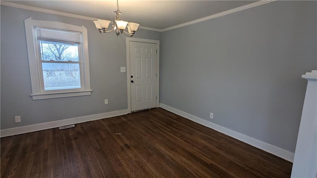 interior space featuring dark wood-type flooring, crown molding, and a chandelier