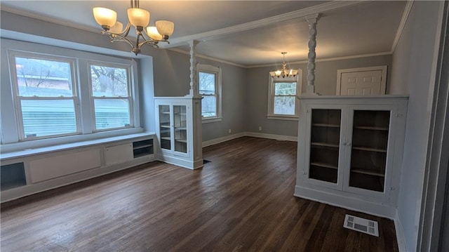 unfurnished dining area featuring a notable chandelier, crown molding, and dark wood-type flooring