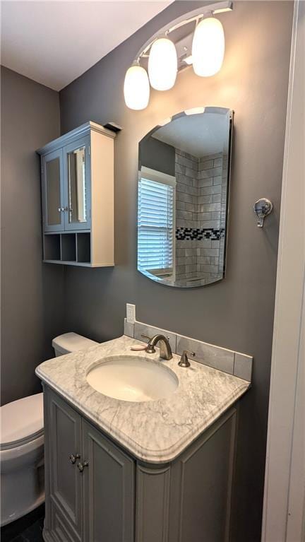 bathroom with vanity and toilet