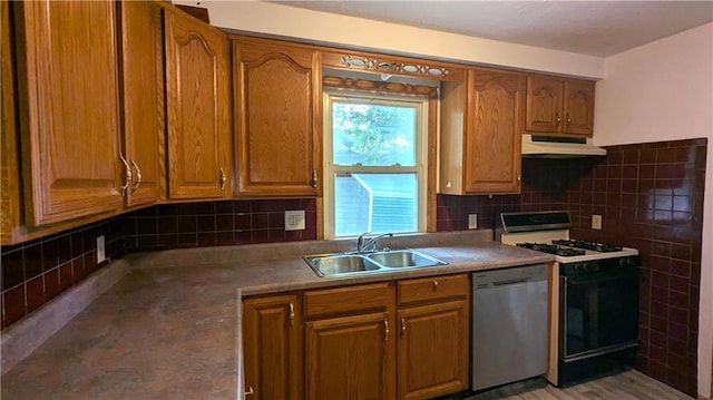 kitchen with tasteful backsplash, gas range, dishwasher, and sink