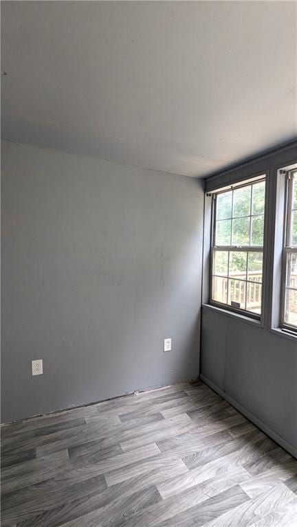 unfurnished room featuring light hardwood / wood-style flooring