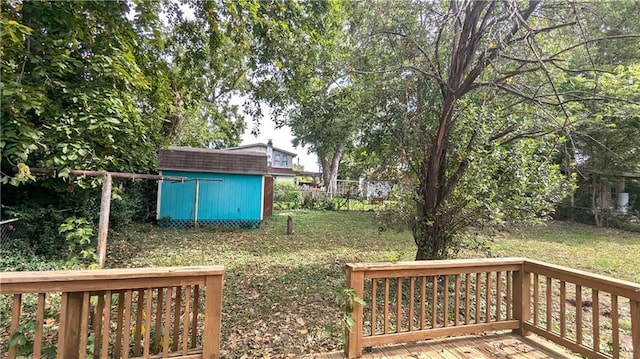 view of yard with a storage shed and a wooden deck