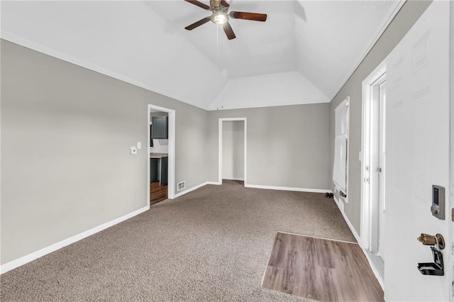 interior space featuring vaulted ceiling, ceiling fan, and crown molding