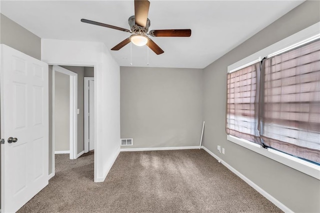 unfurnished bedroom with carpet flooring and ceiling fan