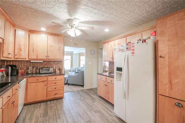 kitchen featuring light brown cabinets, white appliances, light hardwood / wood-style flooring, and ceiling fan