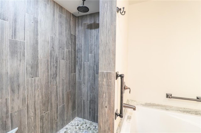 bathroom with a tile shower