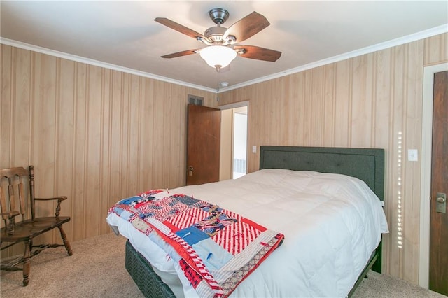 bedroom featuring carpet flooring, ceiling fan, and crown molding