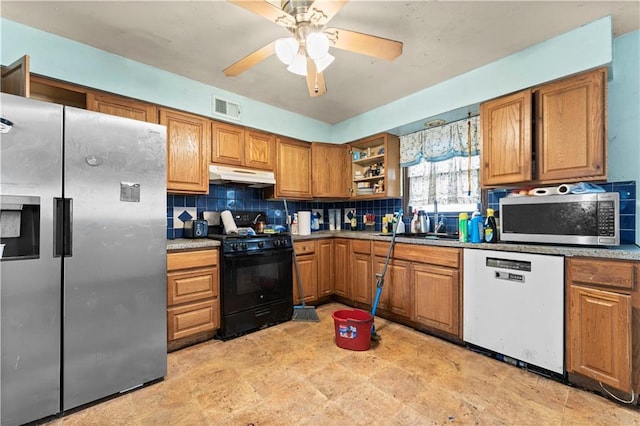 kitchen featuring visible vents, brown cabinetry, decorative backsplash, appliances with stainless steel finishes, and under cabinet range hood