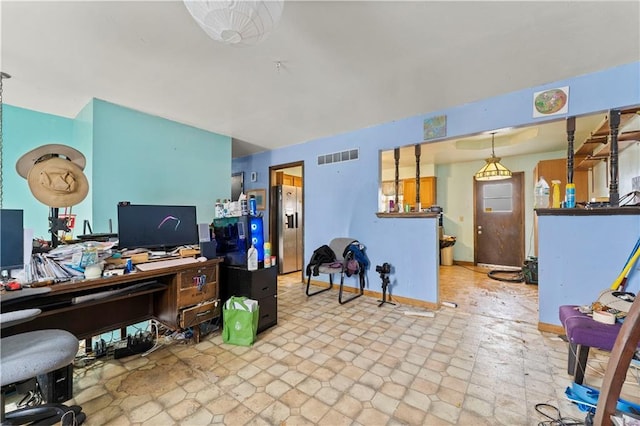 home office featuring visible vents and baseboards