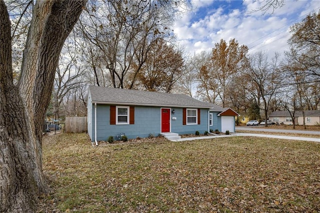 single story home featuring a garage and a front lawn