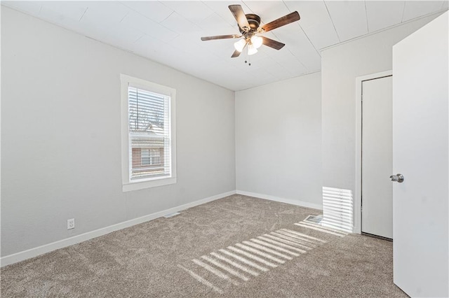 unfurnished room with ceiling fan and light colored carpet