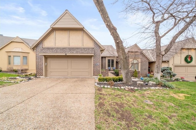 tudor home with a garage and a front yard