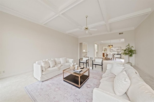 living room with carpet flooring, beam ceiling, ceiling fan with notable chandelier, and coffered ceiling