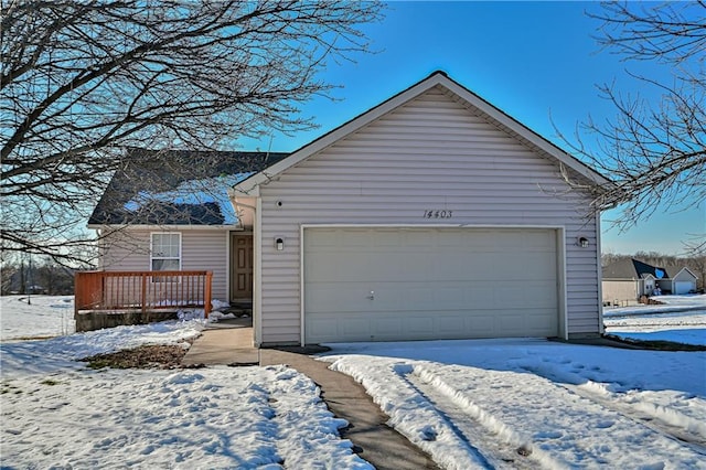 view of snow covered garage