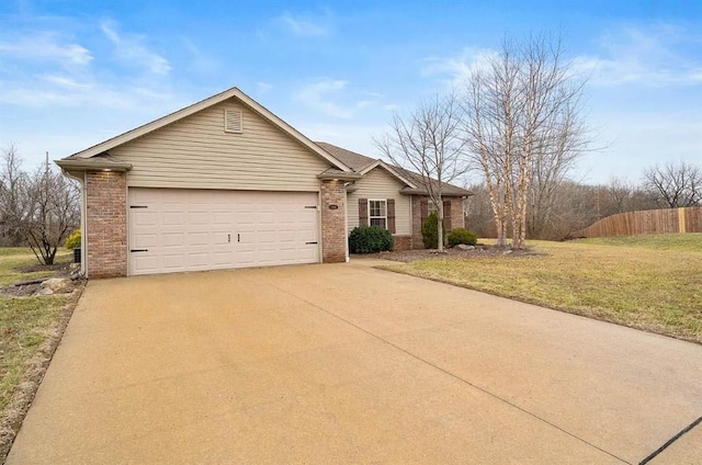 ranch-style home featuring a front yard and a garage