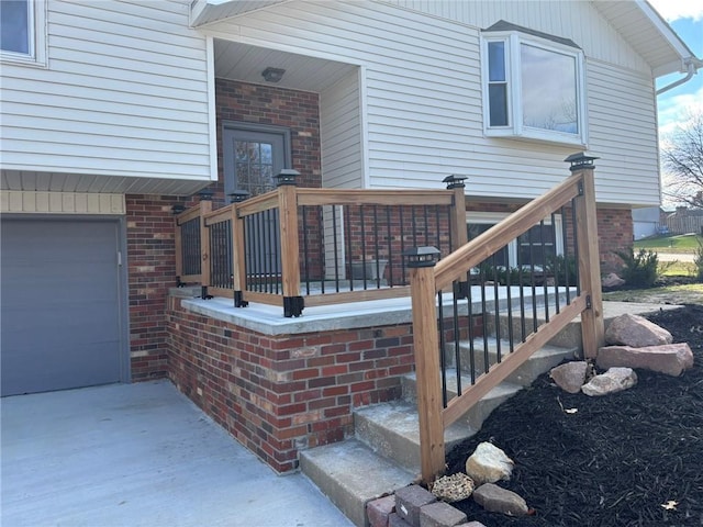 view of exterior entry with brick siding