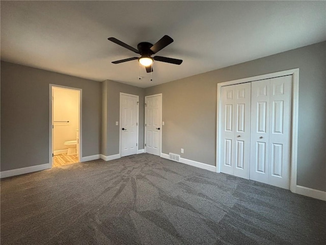 unfurnished bedroom featuring a ceiling fan, dark carpet, visible vents, and baseboards