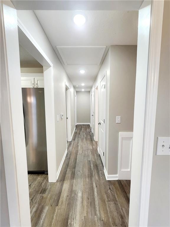 hallway with dark hardwood / wood-style floors