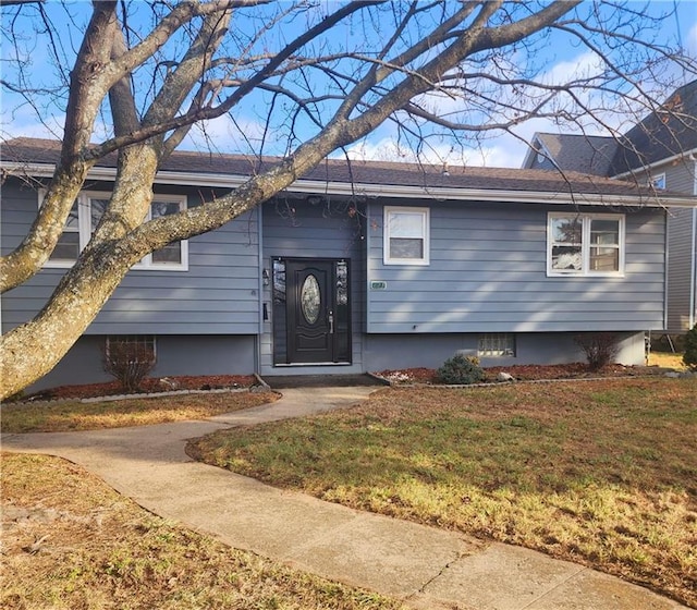 view of front of home with a front lawn