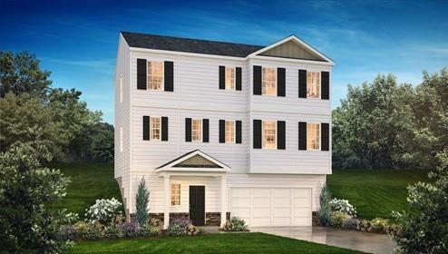 view of front of house featuring a garage, concrete driveway, and a front yard