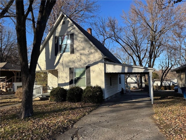 view of home's exterior featuring a carport