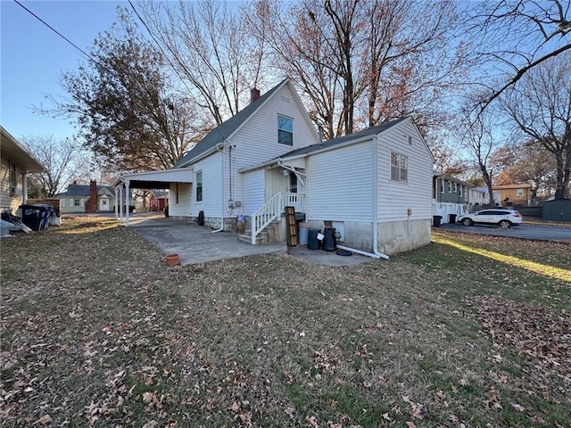 rear view of property featuring a carport