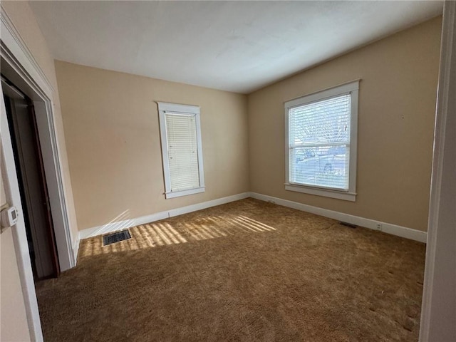 spare room with carpet