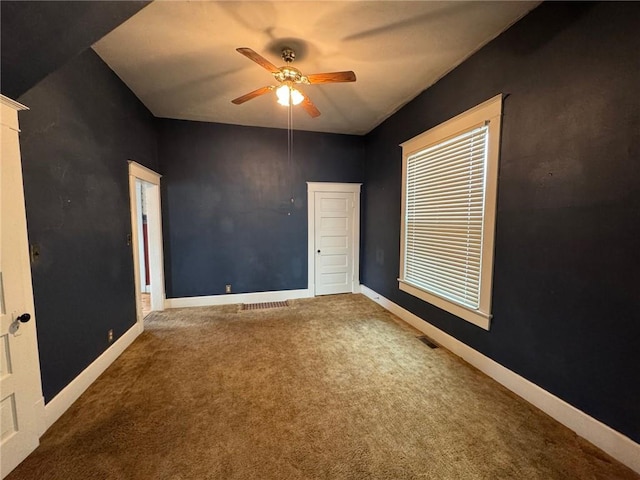 unfurnished bedroom with carpet floors and ceiling fan